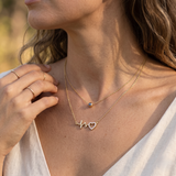 Collier deux rangs à œil bleu et cœur battement scintillant