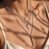 Collier trois rangs à pendentifs cœur, clé et barre