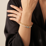Bracelet deux rangs à chaîne dorée et œil bleu