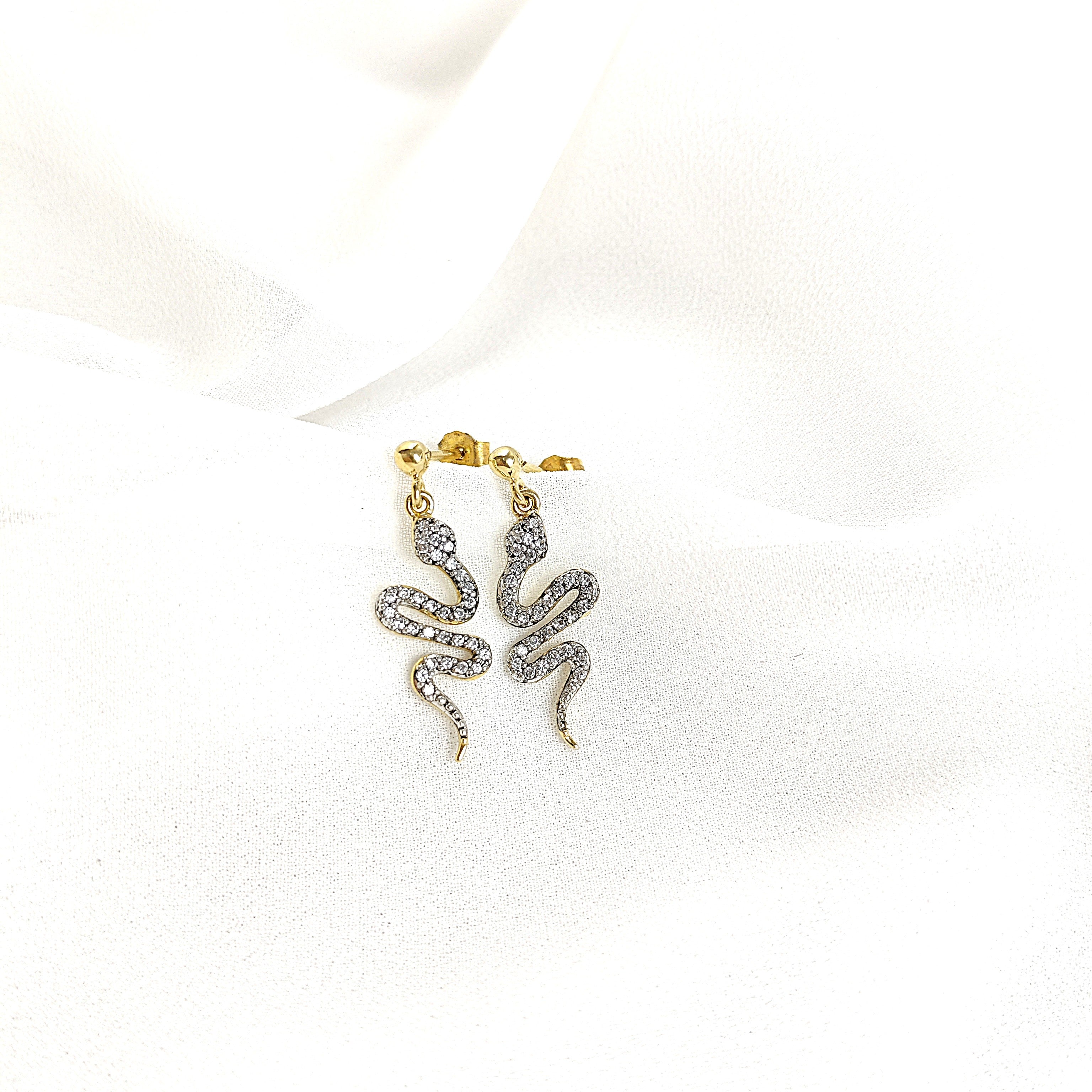 Gold-plated snake earrings paved with zircons