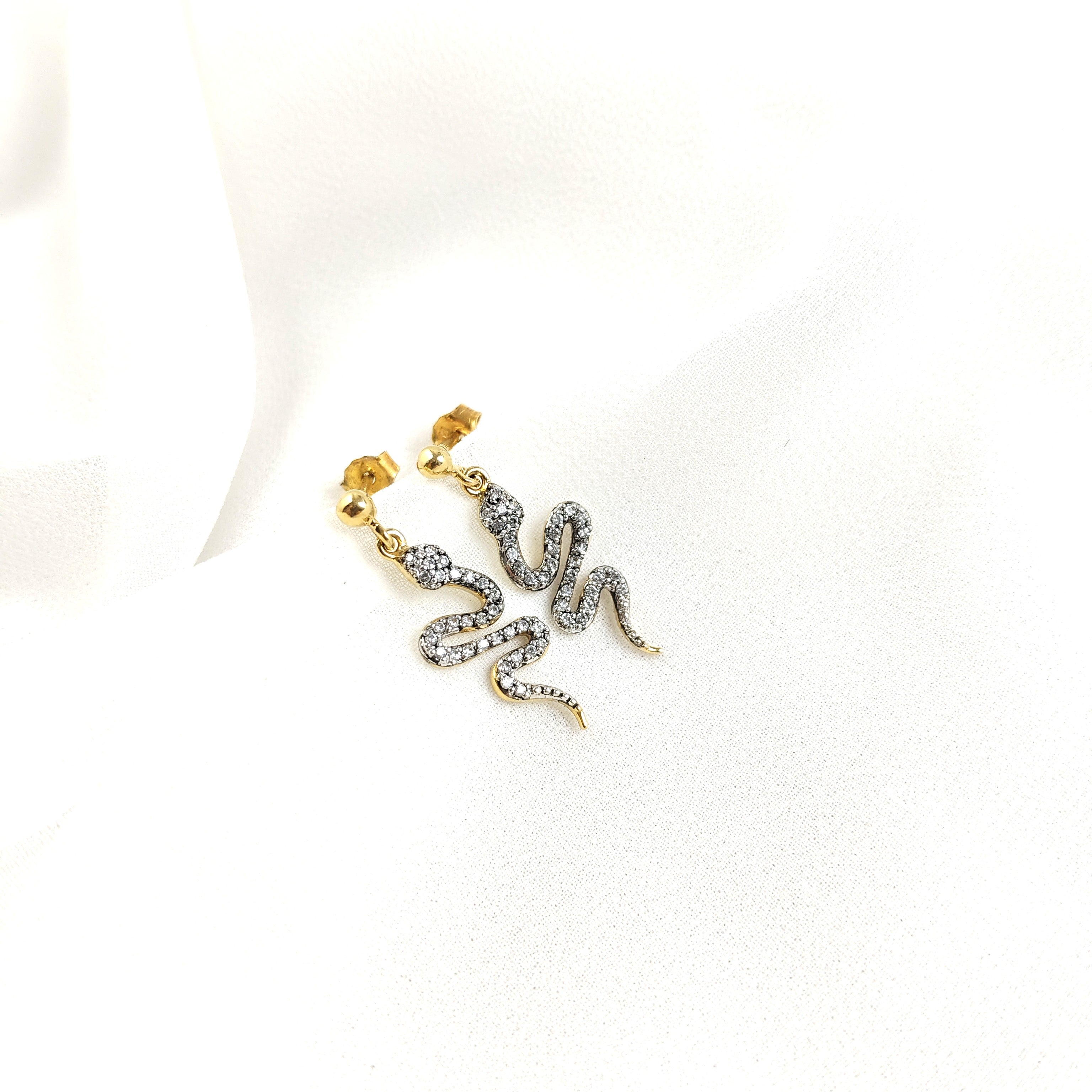 Gold-plated snake earrings paved with zircons