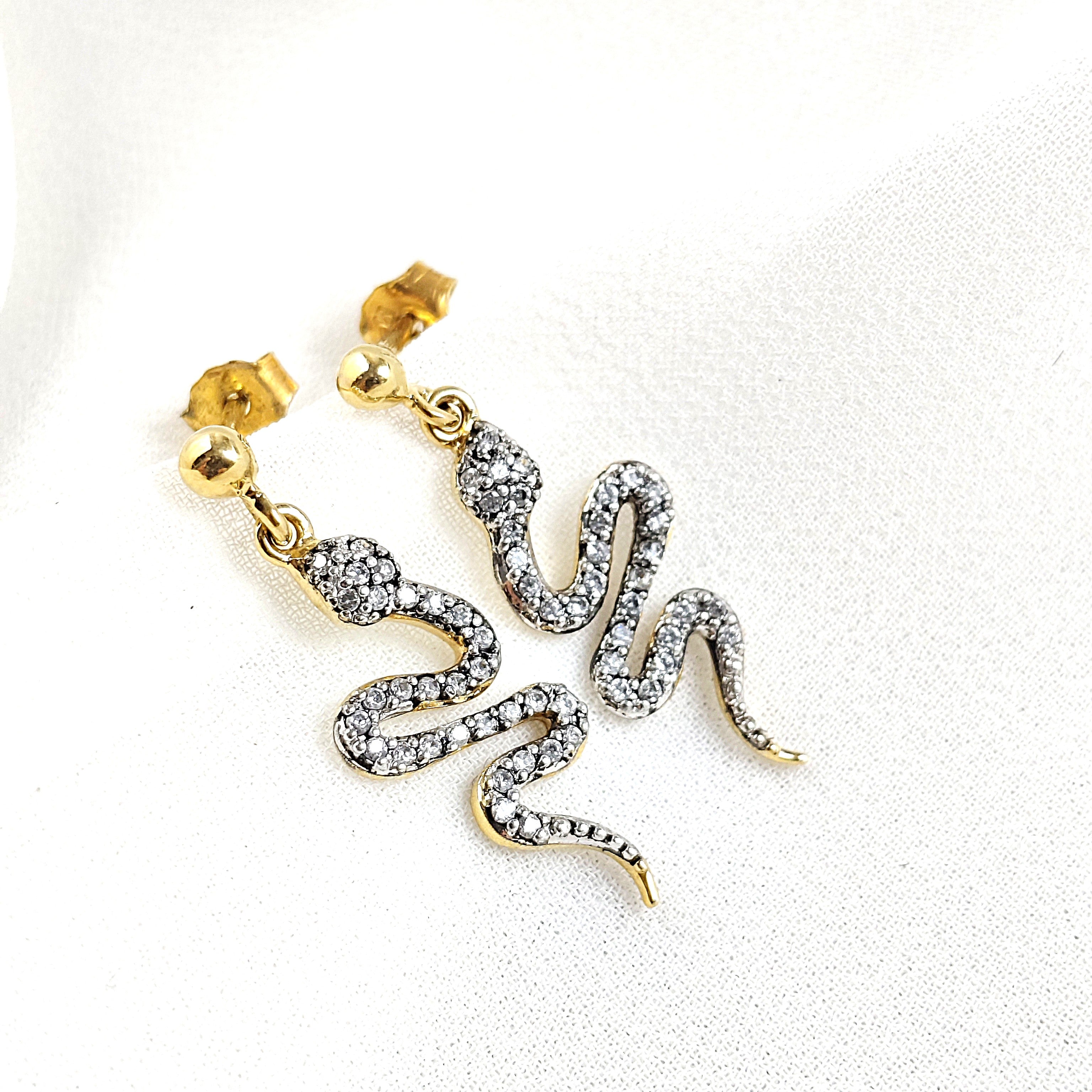Gold-plated snake earrings paved with zircons