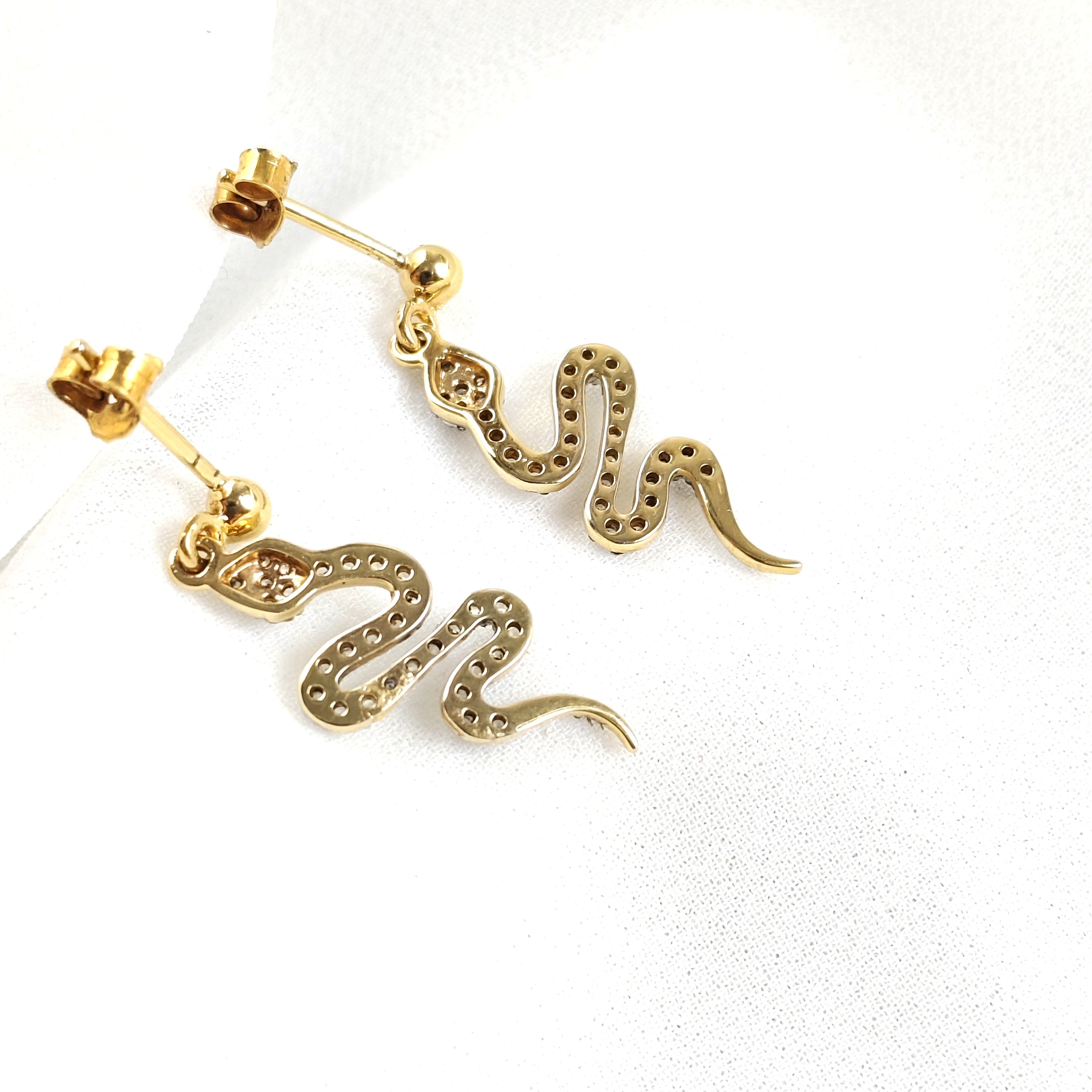 Gold-plated snake earrings paved with zircons