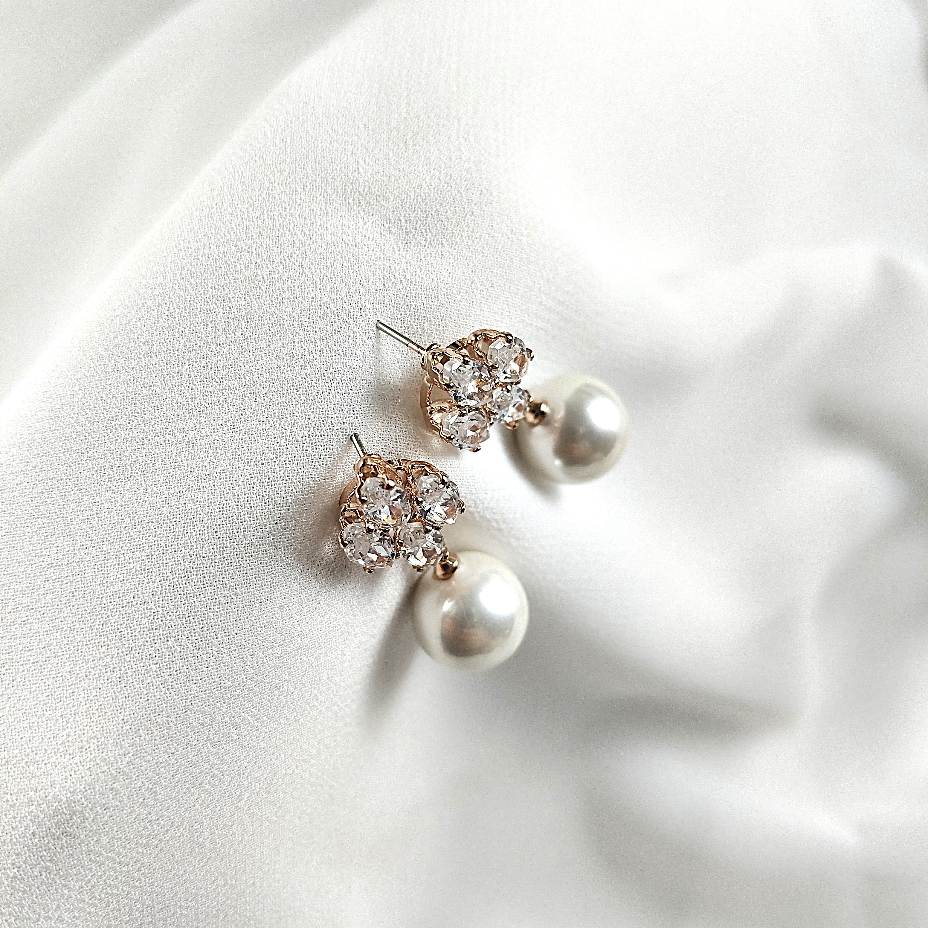 Fashion earrings with pearls and sparkling crystals