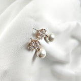 Fashion earrings with pearls and sparkling crystals