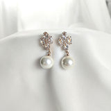 Fashion earrings with pearls and sparkling crystals
