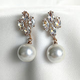 Fashion earrings with pearls and sparkling crystals