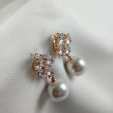 Fashion earrings with pearls and sparkling crystals