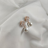 Fashion earrings with pearls and sparkling crystals