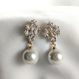 Fashion earrings with pearls and sparkling crystals