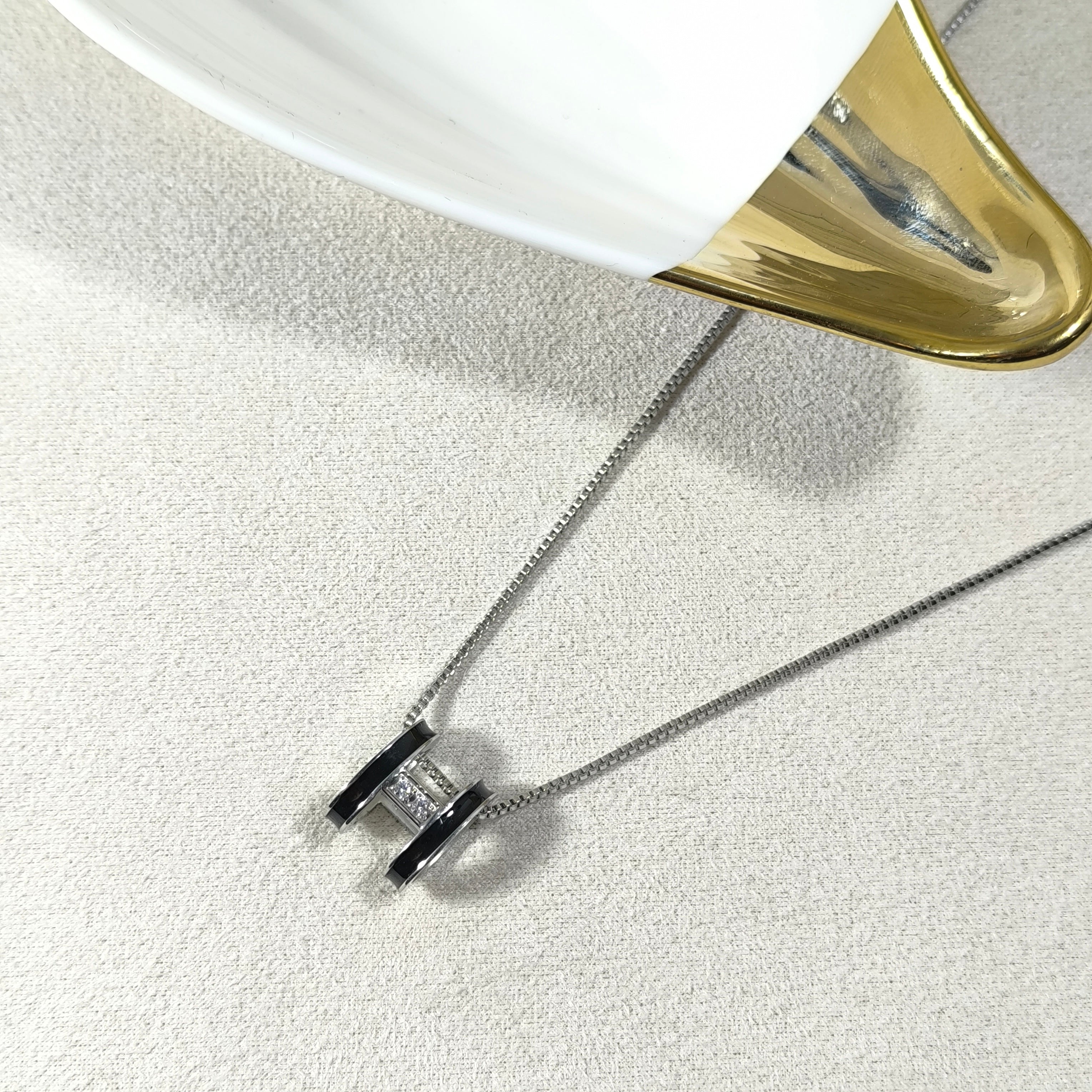 Golden Elegance Necklace – White Enamel & Brilliant Stone Pendant